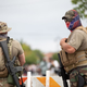 Members of far right militias and white pride organizations rally near Stone Mountain Park in Stone Mountain, Georgia on August 15, 2020.